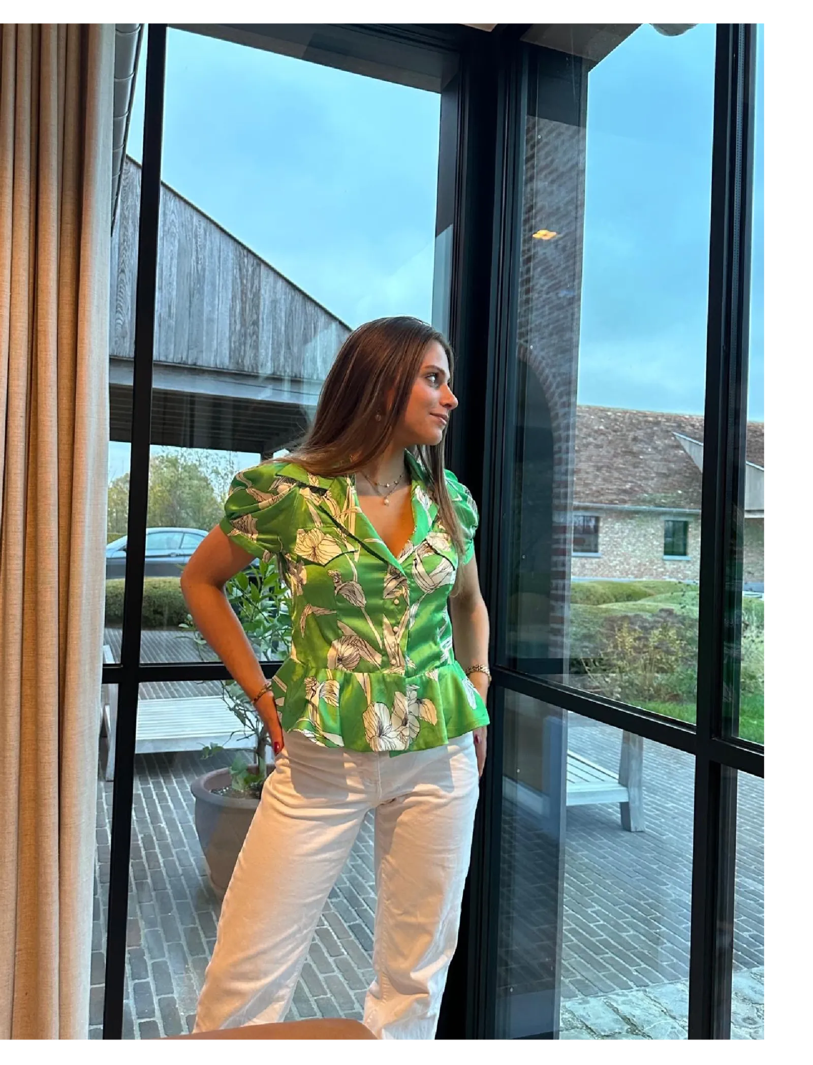 Annick wearing a green tropical print top