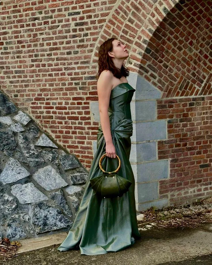 Model wearing the Daisy Bag, showcasing its sculptural silhouette