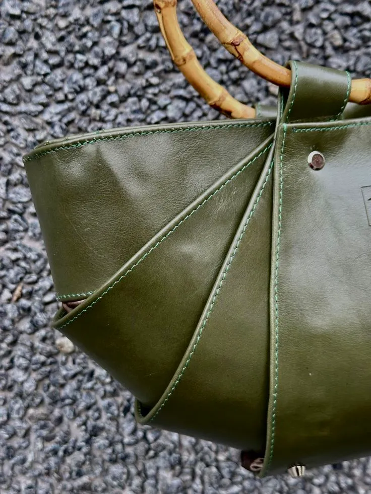 Close-up of the Daisy Bag's interlocking armadillo-inspired panels