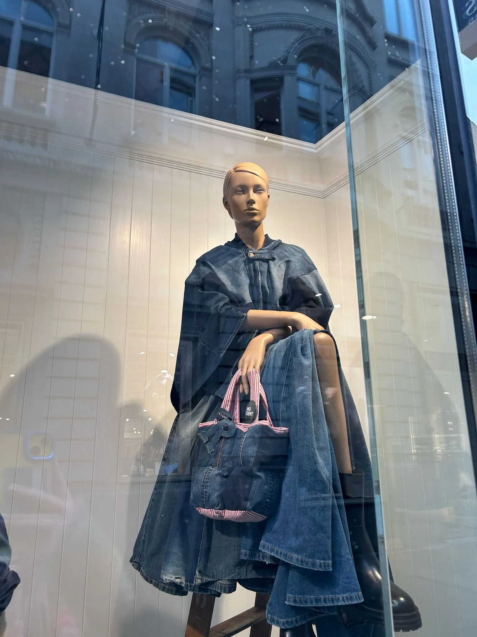 Denim Dusk Poncho displayed in the River Woods showroom